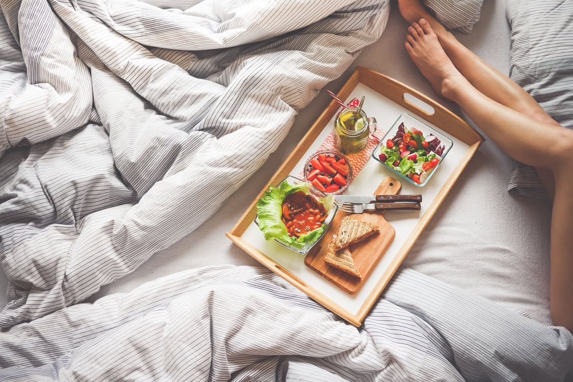 a tray with breakfast is served on bed