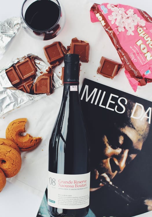 chocolate, wine, cookies and a magazine for guests