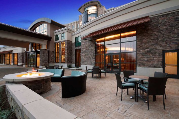 An outdoor seating area at Embassy Suites by Hilton Springfield