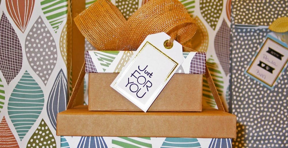 Colourfully wrapped gift boxes with the tag ‘just for you’ indicating exclusivity