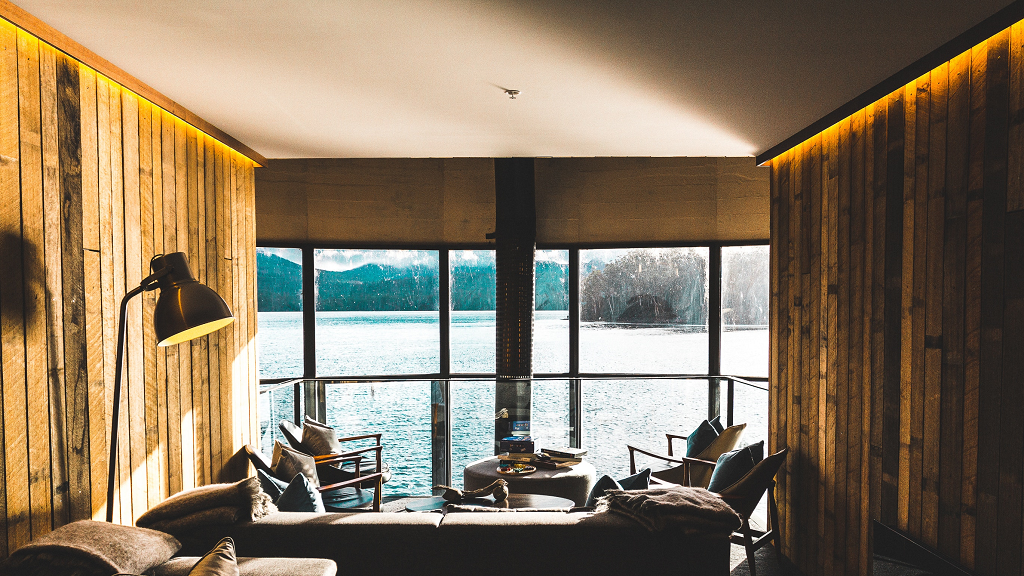 a hotel room overlooking a lake