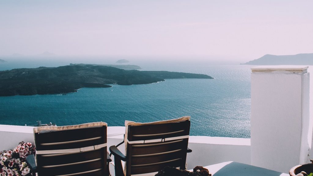 a Greek hotel balcony over the sea